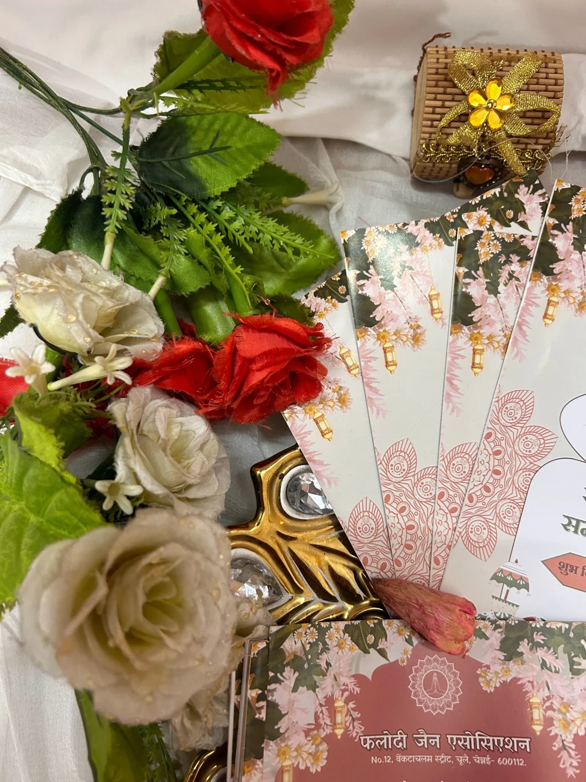 A custom invitation by Desira combining floral illustration, traditional motifs and a soft pink palette